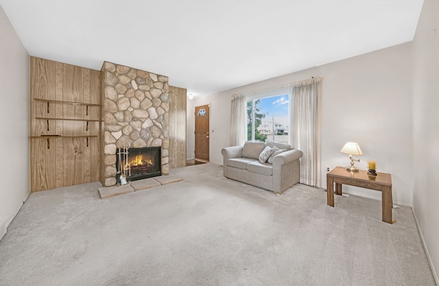 carpeted living room with a fireplace