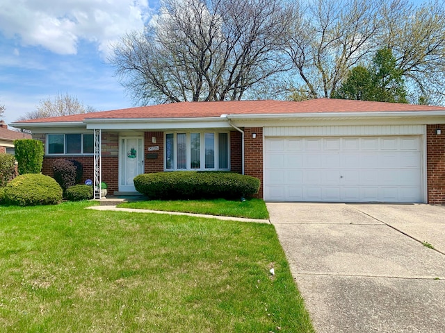 ranch-style home with brick siding, an attached garage, driveway, and a front yard