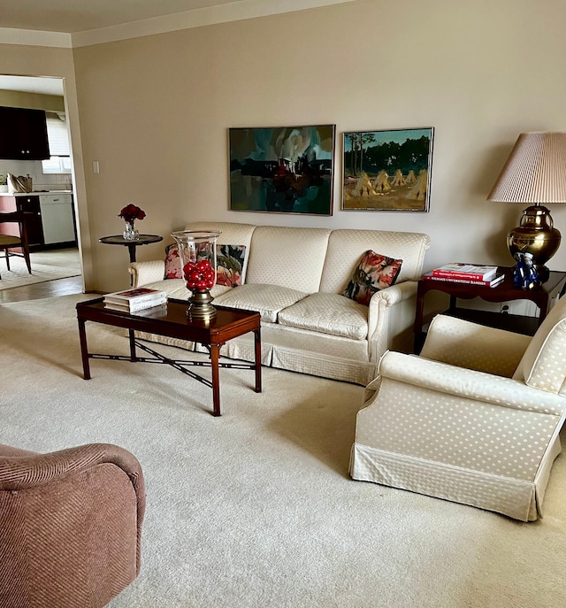 living room with crown molding and carpet
