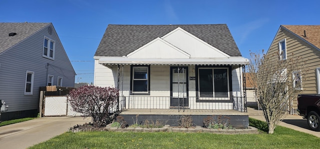 bungalow-style house featuring covered porch and roof with shingles