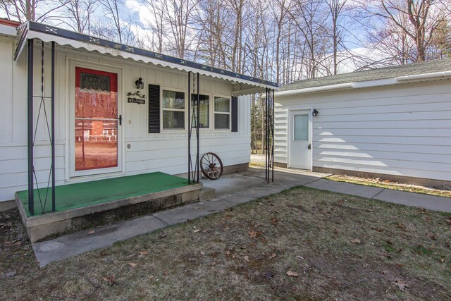 view of exterior entry with board and batten siding