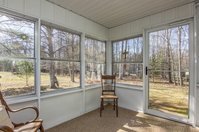 sunroom / solarium with carpet