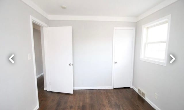 22613 Raven Ave, Eastpointe, MI 48021 - unfurnished bedroom featuring baseboards, a closet, wood finished floors, and visible vents