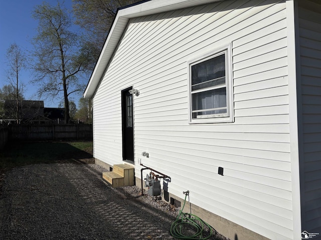 view of home's exterior featuring fence and entry steps