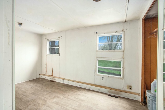 empty room with wood finished floors