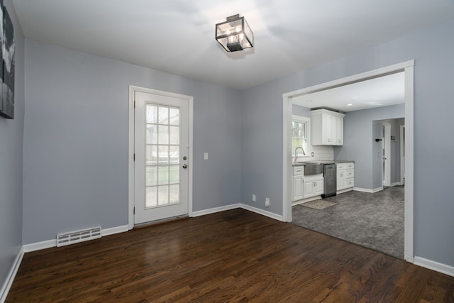 29742 Old Bedford St, Farmington Hills, MI 48331 - unfurnished living room with dark wood-style floors, baseboards, and a sink