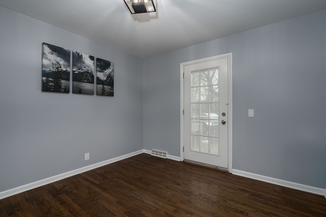29742 Old Bedford St, Farmington Hills, MI 48331 - doorway to outside featuring baseboards and dark wood-style floors