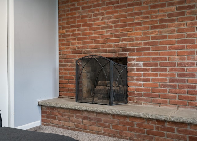 29742 Old Bedford St, Farmington Hills, MI 48331 - detailed view of a fireplace, baseboards, and carpet