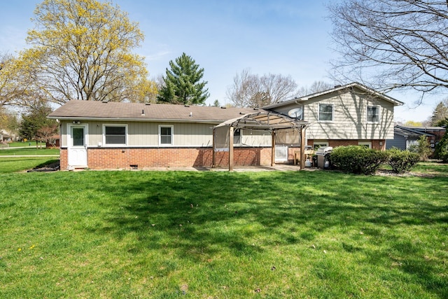29742 Old Bedford St, Farmington Hills, MI 48331 - rear view of property featuring brick siding, a lawn, and a pergola