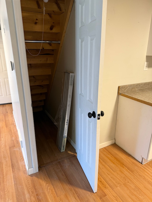 2976 Giddings Blvd, Highland, MI 48356 - room details featuring wood finished floors and baseboards