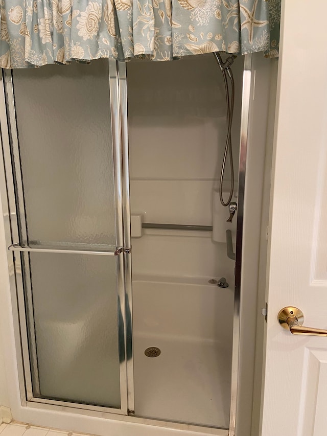 bathroom featuring a stall shower