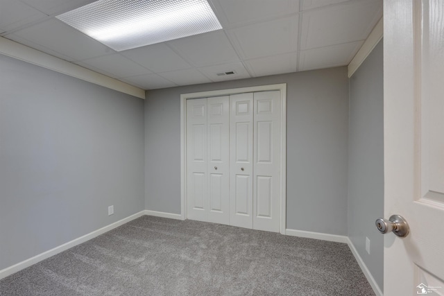 unfurnished bedroom featuring baseboards, visible vents, a closet, and carpet flooring
