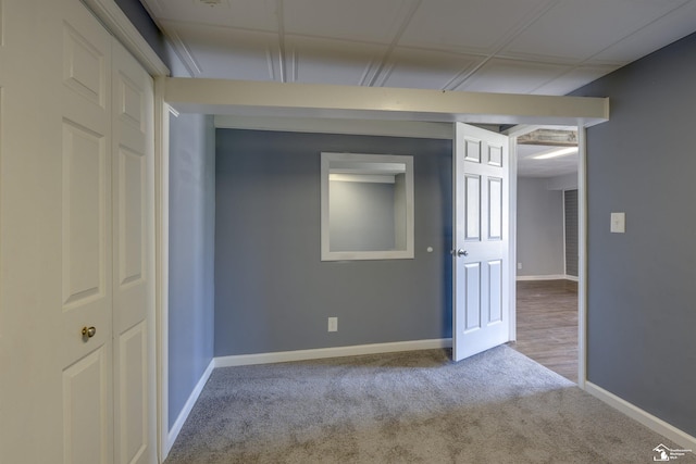 carpeted spare room with baseboards
