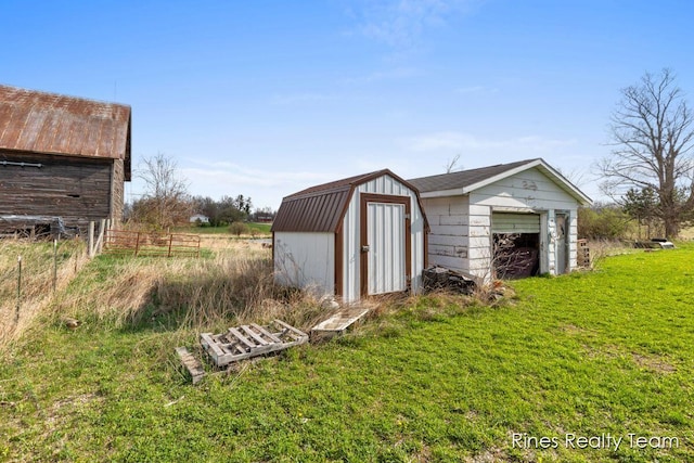 view of shed featuring fence