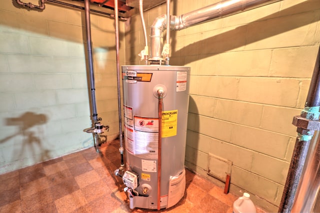utility room featuring gas water heater