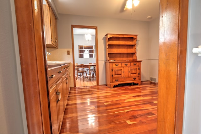 interior space with light wood finished floors and visible vents