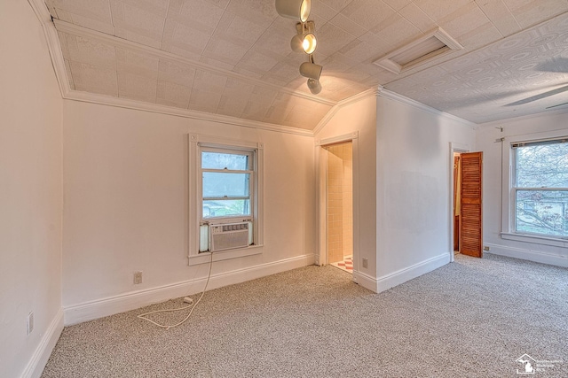 spare room with baseboards, carpet floors, attic access, vaulted ceiling, and cooling unit