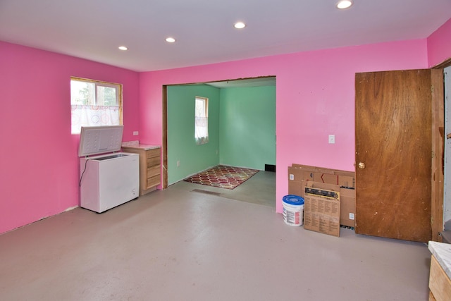 kitchen featuring concrete flooring, recessed lighting, and visible vents
