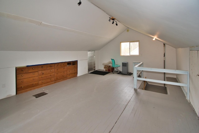 bonus room with vaulted ceiling and hardwood / wood-style flooring