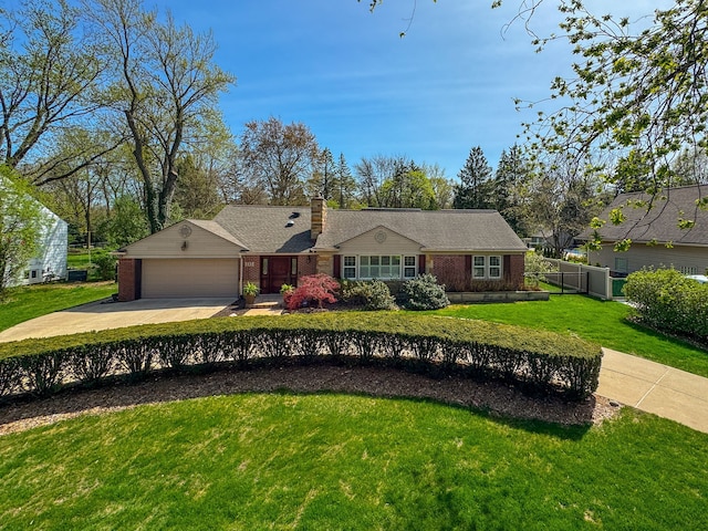single story home featuring an attached garage, concrete driveway, a front lawn, and brick siding