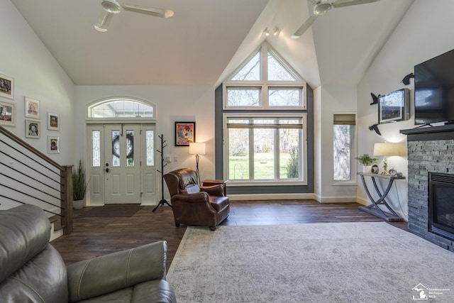 living room with high vaulted ceiling, ceiling fan, and plenty of natural light