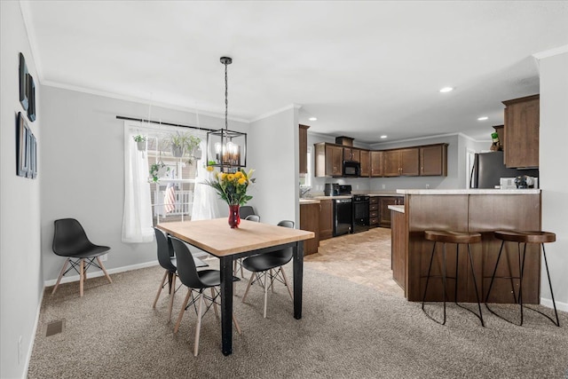 dining room with crown molding, light colored carpet, visible vents, baseboards, and recessed lighting