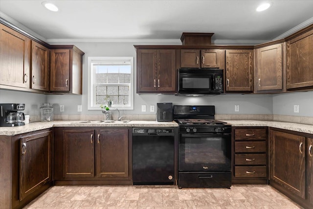 kitchen with black appliances, a sink, and dark brown cabinets