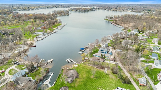 drone / aerial view with a residential view and a water view