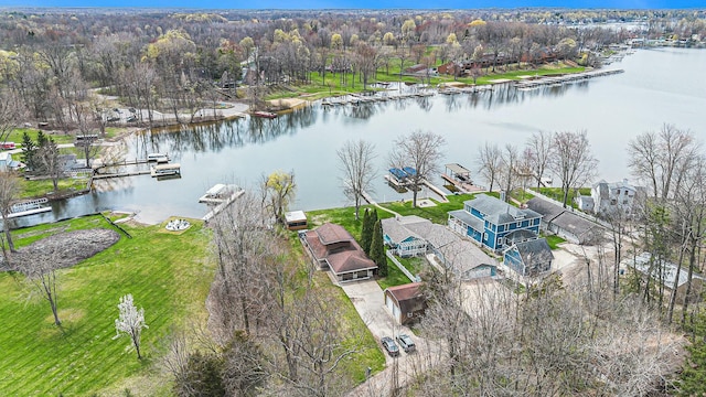birds eye view of property with a residential view and a water view