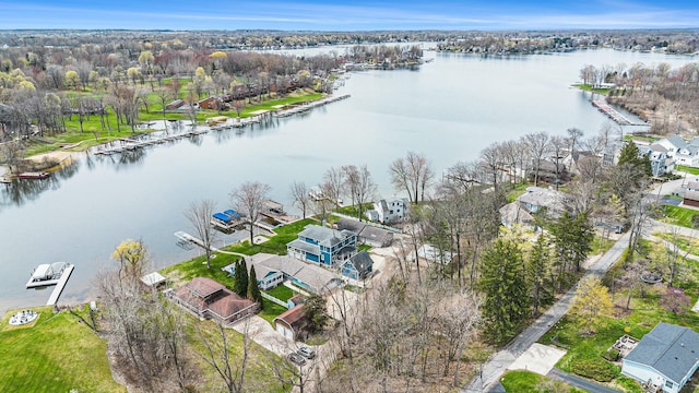 bird's eye view with a residential view and a water view