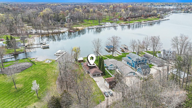 drone / aerial view featuring a residential view and a water view