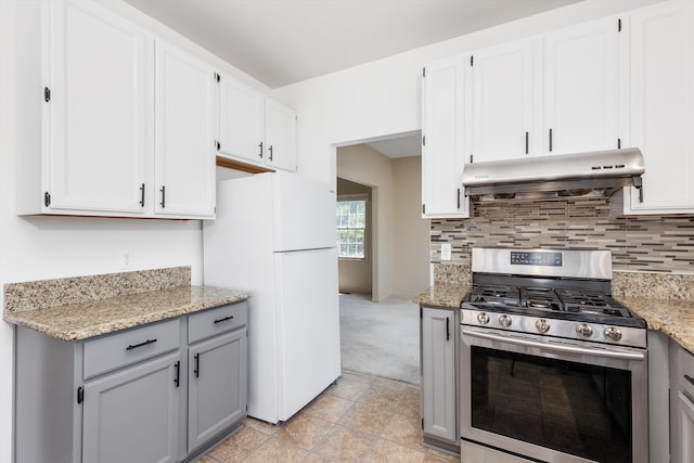 30701 Sandalwood Cir, Novi, MI 48377 - kitchen with gray cabinetry, stainless steel gas range oven, freestanding refrigerator, and under cabinet range hood
