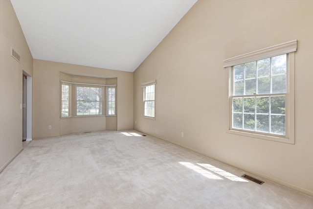 30701 Sandalwood Cir, Novi, MI 48377 - carpeted spare room with baseboards, visible vents, and high vaulted ceiling