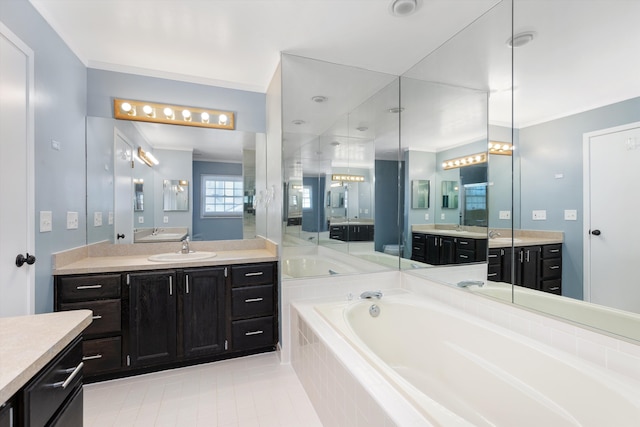 30701 Sandalwood Cir, Novi, MI 48377 - full bath with a sink, ornamental molding, tile patterned floors, two vanities, and a garden tub