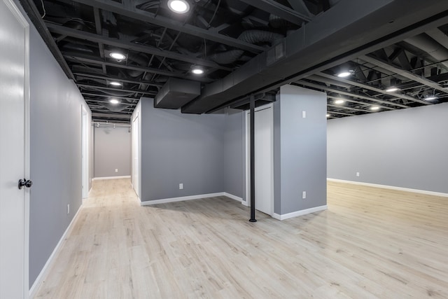 30701 Sandalwood Cir, Novi, MI 48377 - finished basement featuring wood finished floors and baseboards