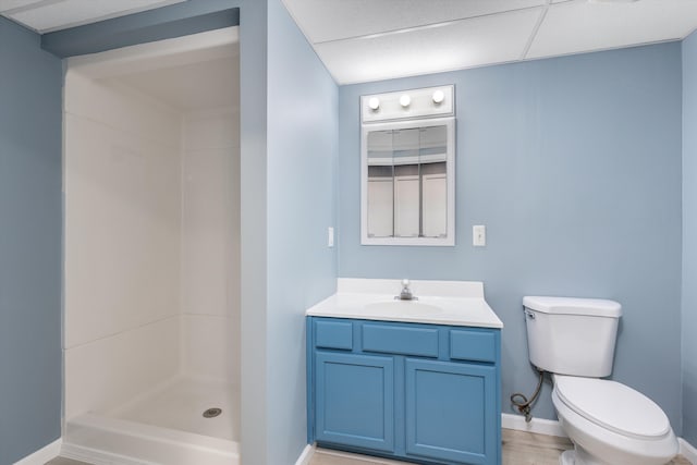 30701 Sandalwood Cir, Novi, MI 48377 - bathroom with toilet, a shower stall, vanity, and baseboards