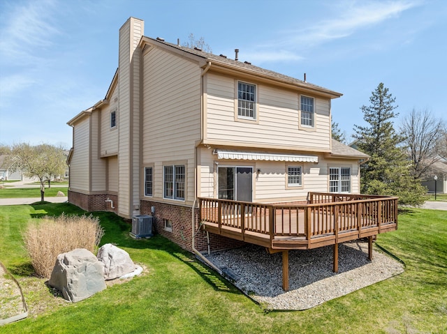 30701 Sandalwood Cir, Novi, MI 48377 - back of house with a wooden deck, central AC unit, a yard, a chimney, and brick siding