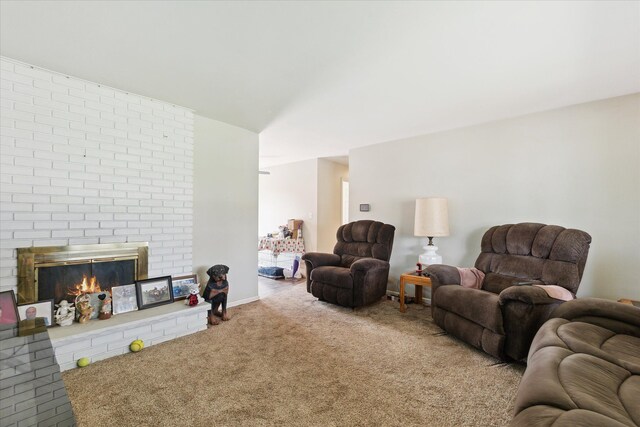 living room featuring carpet floors and a brick fireplace
