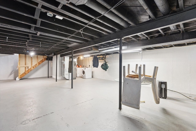 basement with stairs and washer and dryer