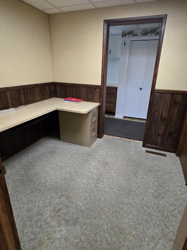 609 1st St, Lake Odessa, MI 48849 - unfurnished office with visible vents, a wainscoted wall, carpet floors, built in study area, and a drop ceiling