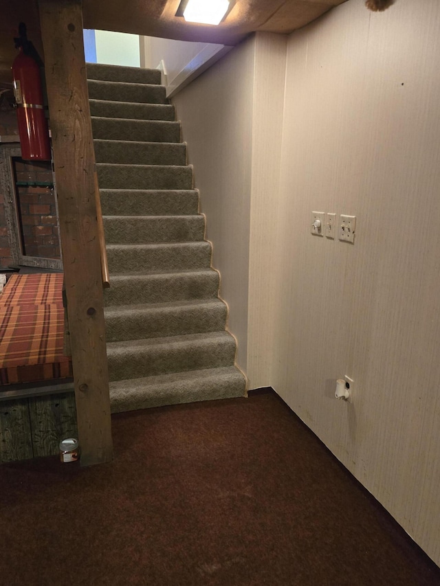 609 1st St, Lake Odessa, MI 48849 - staircase featuring carpet flooring