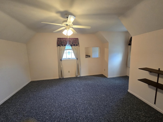 609 1st St, Lake Odessa, MI 48849 - additional living space featuring ceiling fan, baseboards, vaulted ceiling, and carpet floors