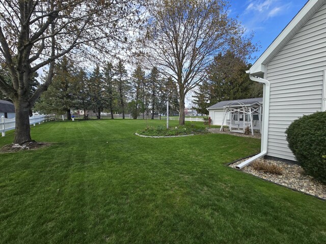 609 1st St, Lake Odessa, MI 48849 - view of yard featuring a garage