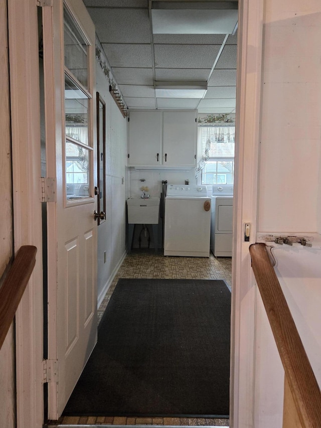 609 1st St, Lake Odessa, MI 48849 - laundry room featuring washer and clothes dryer, laundry area, and a sink