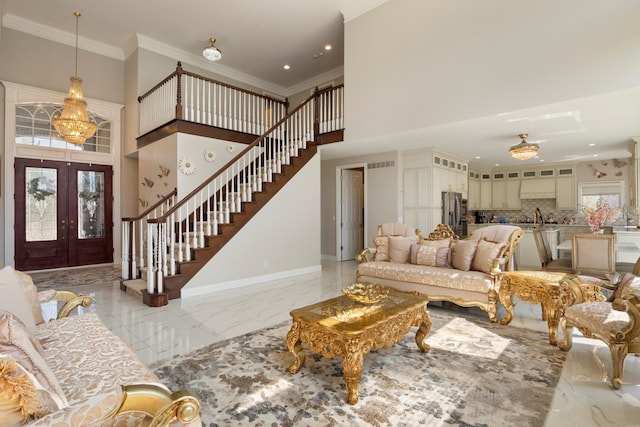 living area with crown molding, stairway, baseboards, french doors, and a high ceiling