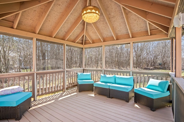 sunroom / solarium featuring an inviting chandelier and plenty of natural light