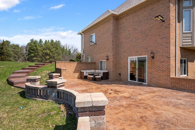 exterior space featuring a patio area and an outdoor hangout area