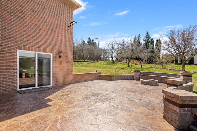 view of patio with an outdoor fire pit