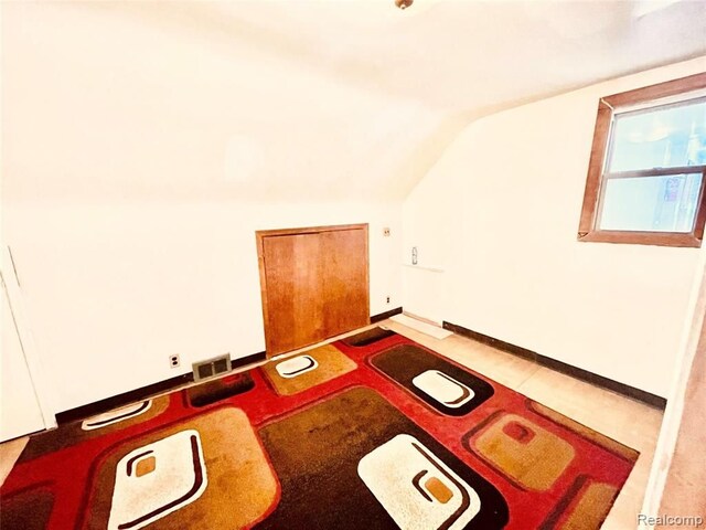 bonus room with vaulted ceiling