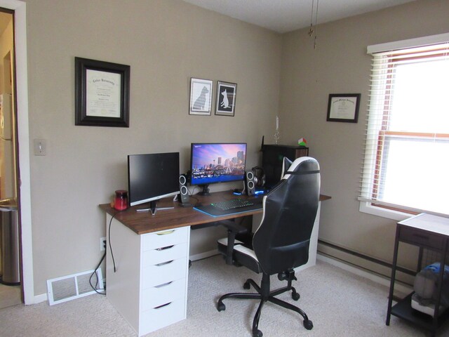 117 Vista Ct, Roscommon, MI 48653 - office area featuring baseboards, plenty of natural light, light carpet, and visible vents